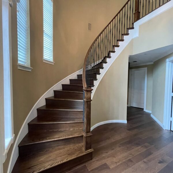 Wooden staircase done by The Woodlands Premier Remodeling