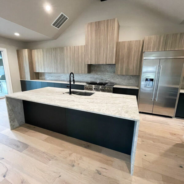 Kitchen remodel featuring waterfall island in The Woodlands, TX done by The Woodlands Premier Remodeling