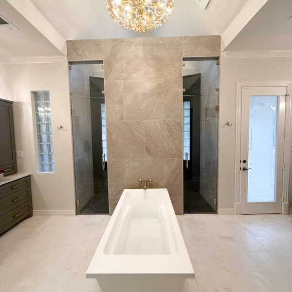 Modern bathroom with chandelier and sunken bathtub in the middle