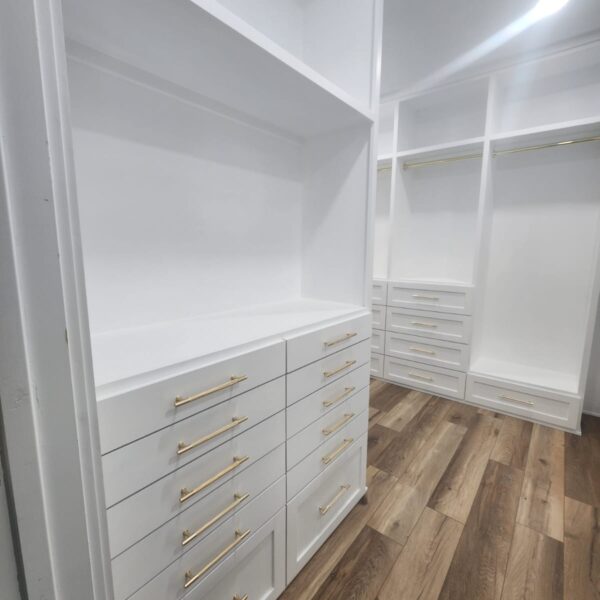 The Woodlands Premier Remodeling primary closet after photo featuring Custom Cabinetry and Storage