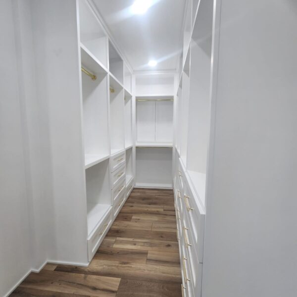 The Woodlands Premier Remodeling primary closet after photo featuring Custom Cabinetry and Storage